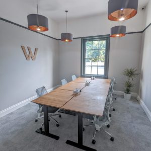 A spacious, airy, and well-lit private office with six desks.